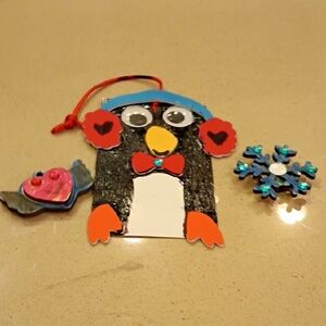 Penguin With A Magnet Snowflake And Heart Face With Wings
